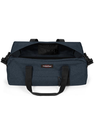 Eastpak Station + Duffelbag -  Triple Denim, fotad mot en vit bakgrund.