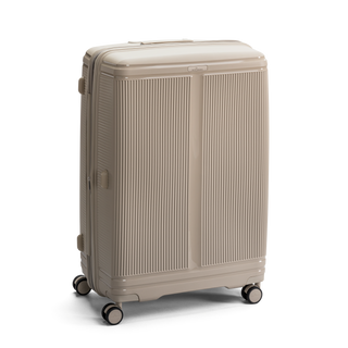 North Pioneer New York Stor Resväska 77 cm - Beige hårdskal med vågmönster – teleskophandtag i kopparfärg och 360° hjul för smidig manövrering och stilren design fotad mot en vit bakgrund 