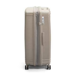 North Pioneer New York Stor Resväska 77 cm - Beige hårdskal med vågmönster – teleskophandtag i kopparfärg och 360° hjul för smidig manövrering och stilren design fotad mot en vit bakgrund 