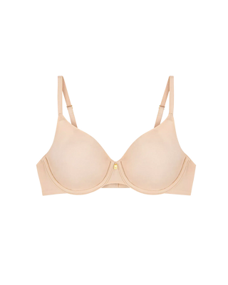 Triumph Body Make-Up Essentials Bygel-BH i nude beige, frilagd mot vit bakgrund.