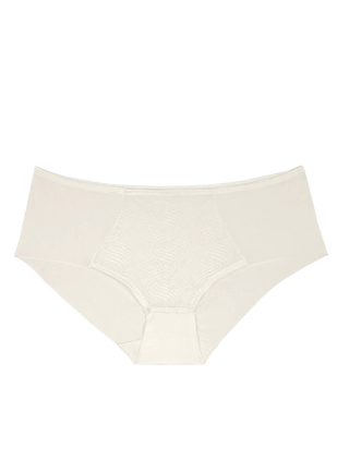 “Frilagd bild av Triumph sömlös trosa – lågskuren modell i fjäderlätt jacquardmaterial med polkaprickigt mönster.”