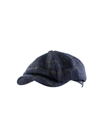 Wigéns Newsboy Classic Keps i Ull - Mörkblåmelerad med Klassiskt Rutmönster, sygg och härlig herr keps fotad mot en vit/grå bakgrund 