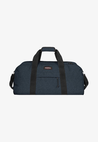 Eastpak Station + Duffelbag -  Triple Denim, fotad mot en vit bakgrund.