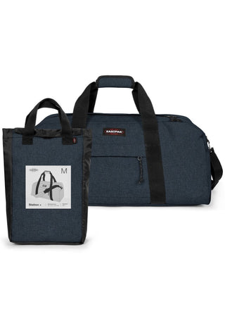 Eastpak Station + Duffelbag -  Triple Denim, fotad mot en vit bakgrund.