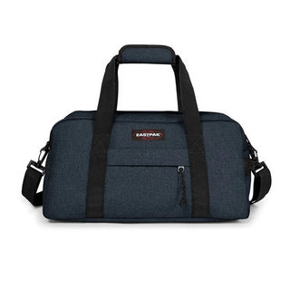 Eastpak Compact+ Duffelbag - Triple Denim, fotad mot en vit bakgrund.