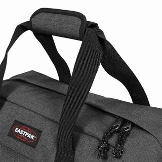 Eastpak Compact+ Duffelbag - Black Denim, fotad mot en vit bakgrund.