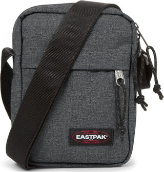 Eastpak The One Crossbodyväska - Black Denim, fotad mot en vit bakgrund.